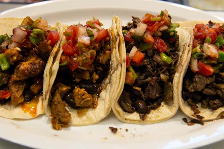 Tacos dish with different styles, fish, shrimp and beef.